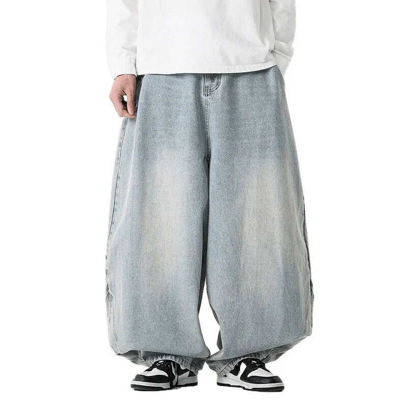 Men's plus size light blue wide leg baggy jeans on a hanger