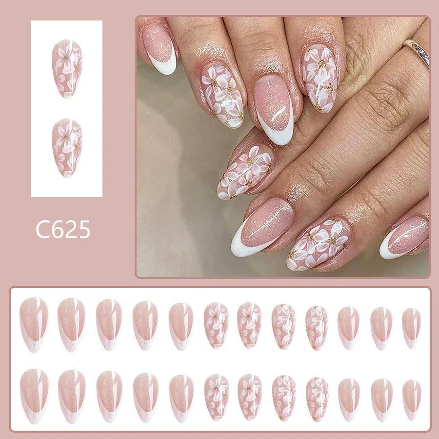 Short almond shaped French style false nails with glitter and floral patterns C625 colour