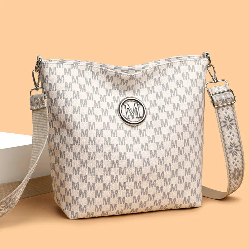 PU leather retro dumpling-shaped shoulder bag in black, brown and white colours with sandwich pocket design