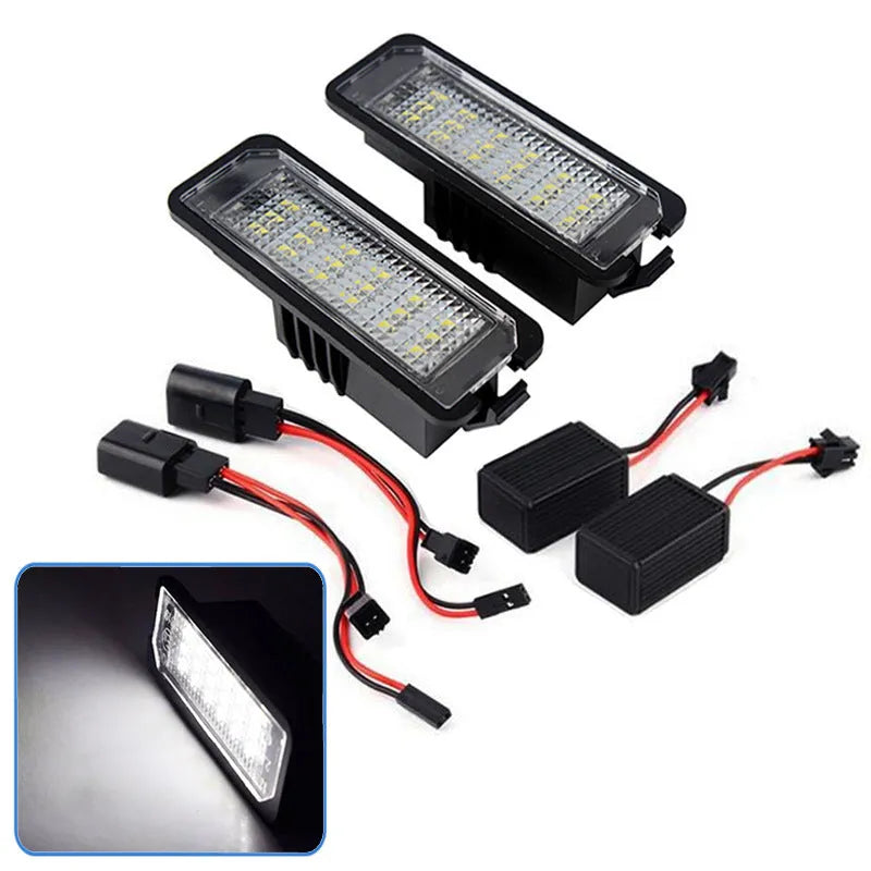 Two Volkswagen LED license plate light bulbs with SMD LEDs and plug connectors.