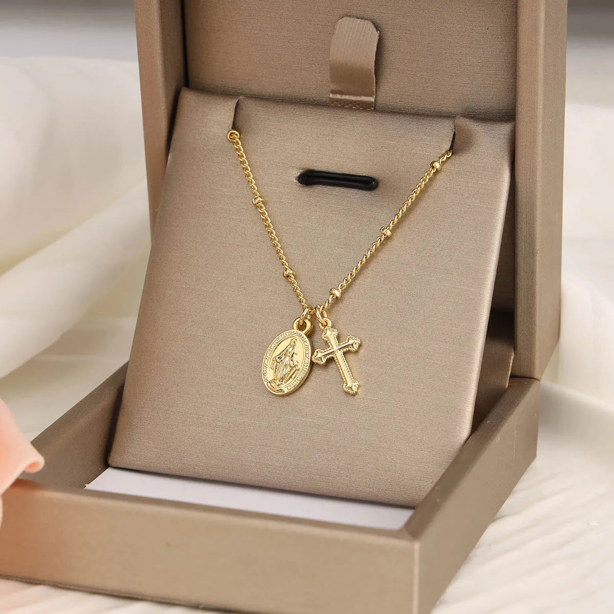 Gold geometric Virgin Mary cross necklace pendant on chain