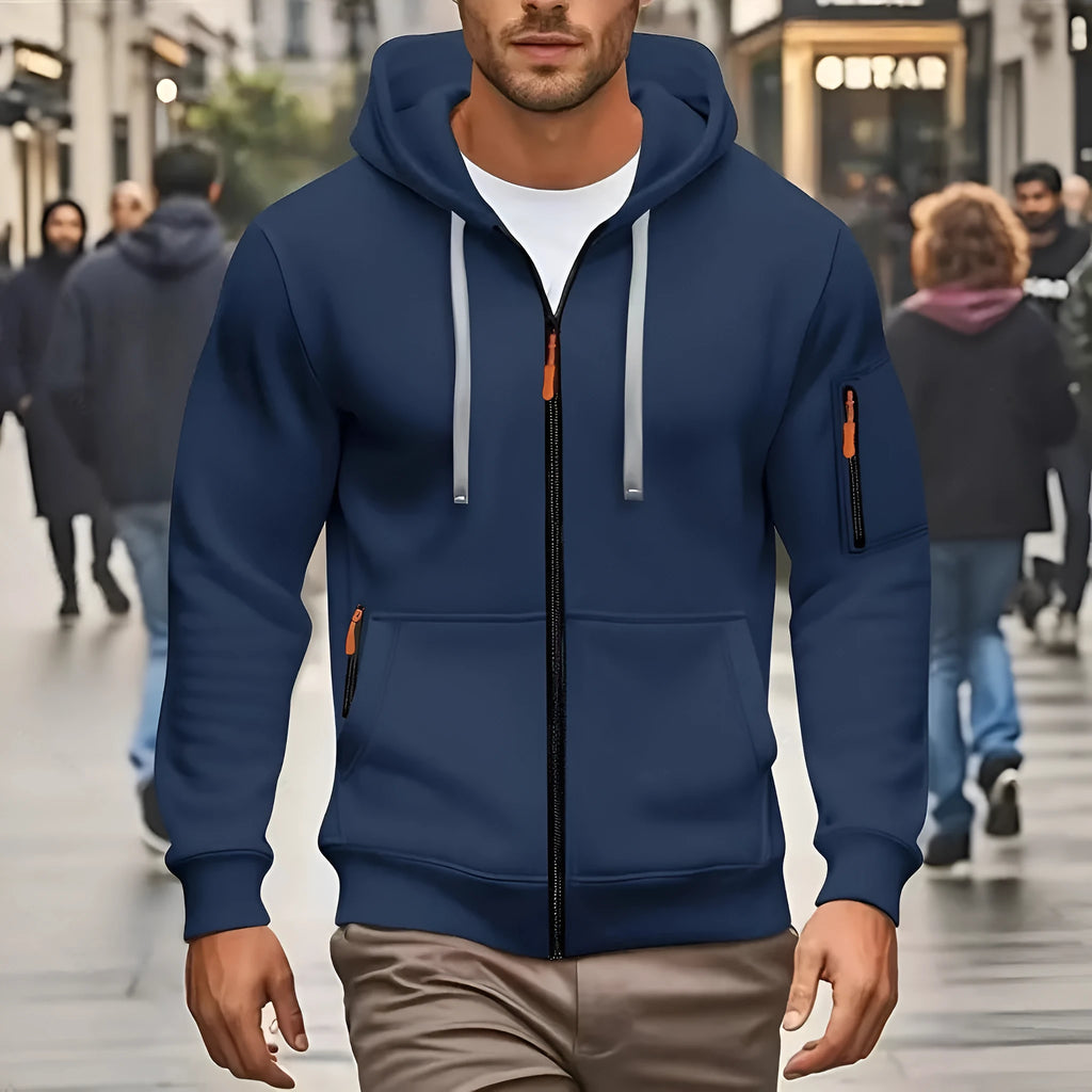 Man wearing a zip-up fleece-lined hooded sweatshirt in army green colour.