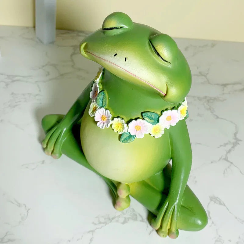 Magic yoga frog resin and plastic ornament in RDW123 colour on a shelf.