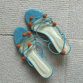 Cyan women's leather high-heel sandals with lace-up straps and ball decoration