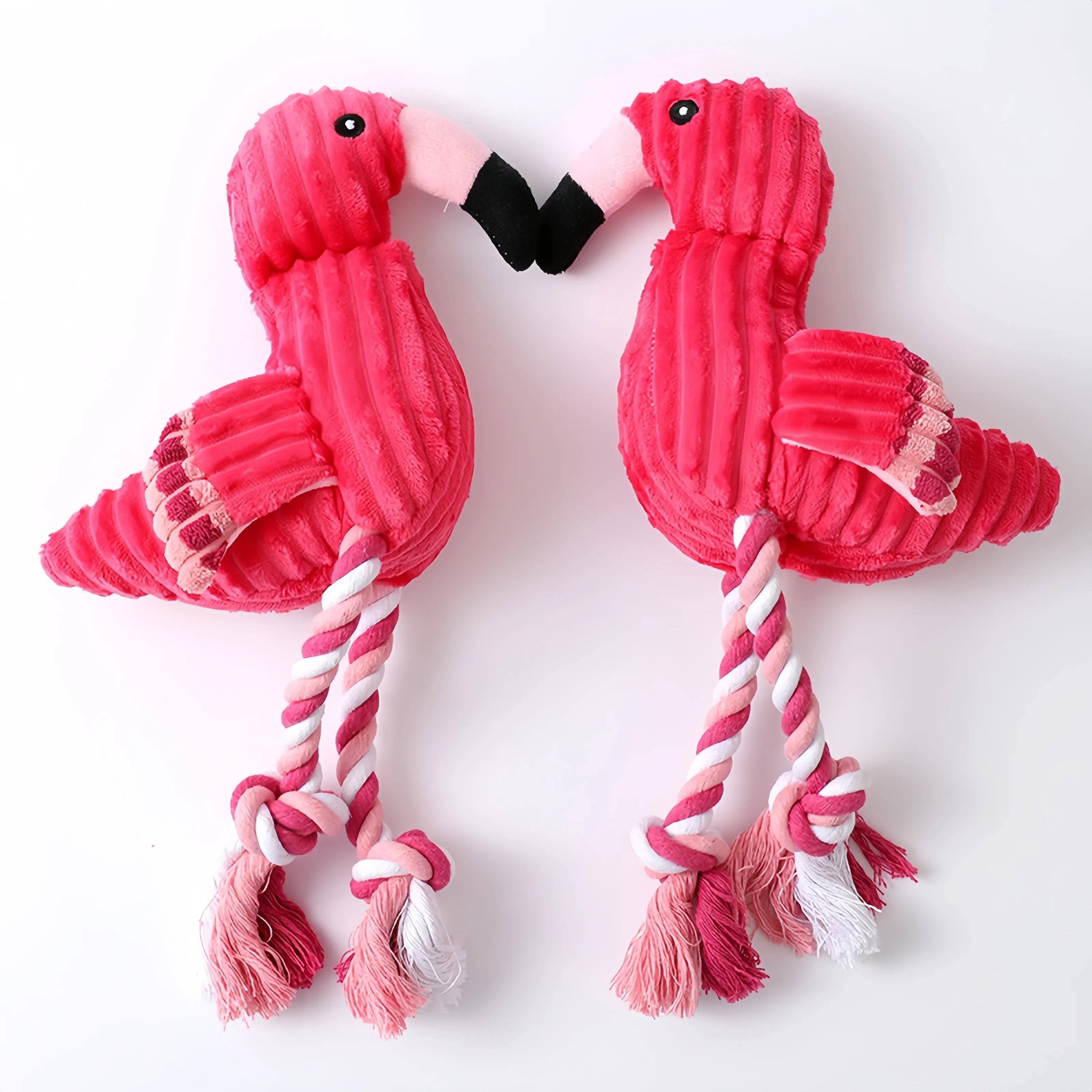 Pink corduroy animal-shaped squeaky dog toy with reinforced stitching