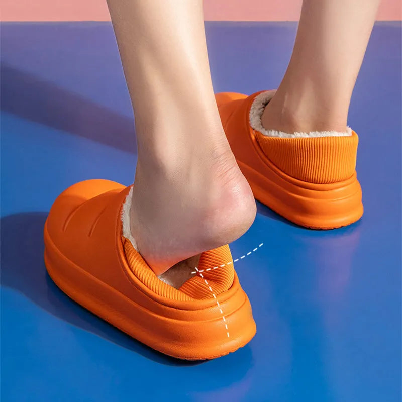 A pair of waterproof EVA garden slippers with a plush lining, shown in a solid colour with a non-slip sole.