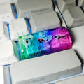 Resin keycap with koi fish swimming through scenery design for Cherry MX mechanical keyboards