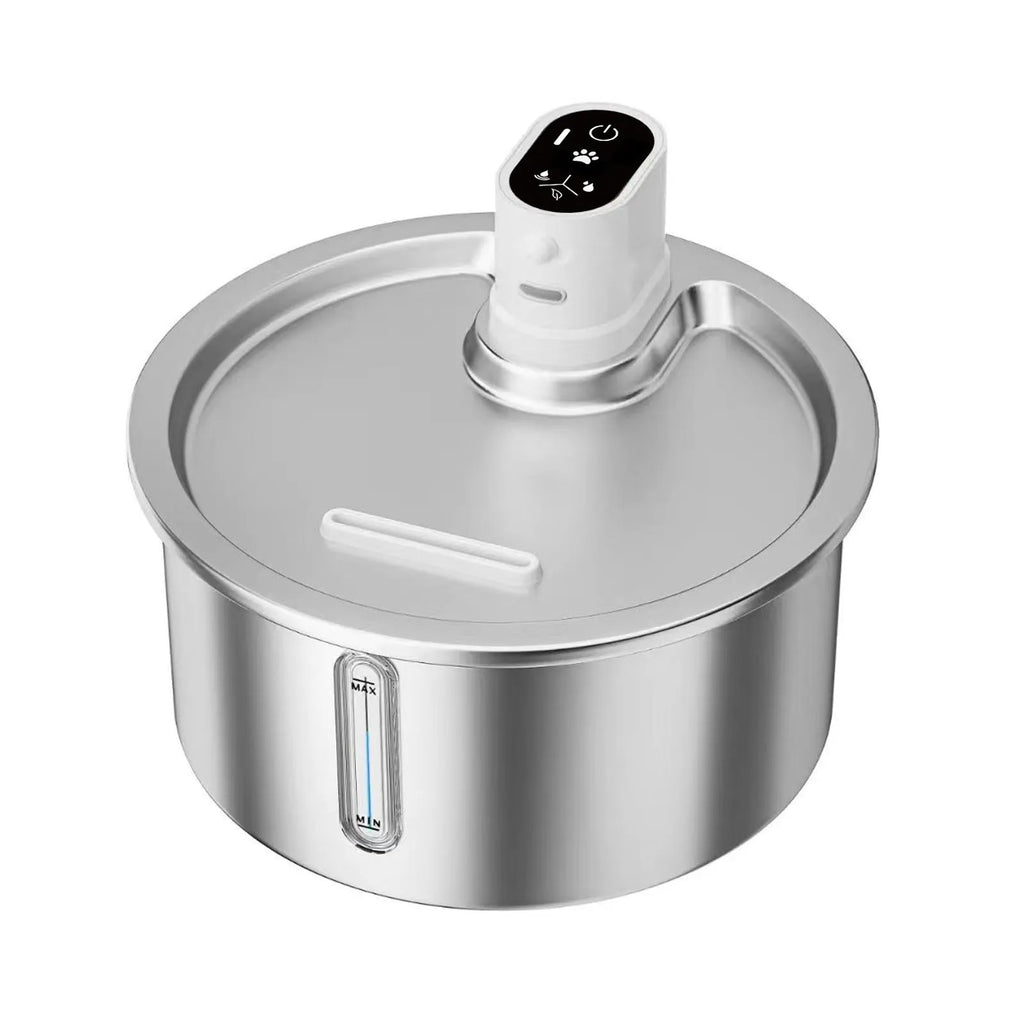 White stainless steel heated pet water fountain on a table with charging cable.