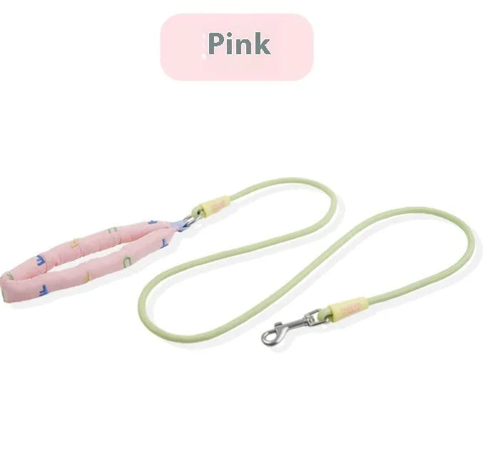 Polyester dog leash in green colour, showing hand holding rope design and clip.