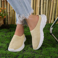Women's mesh casual wedge heel slipper in beige with round toe and rubber sole