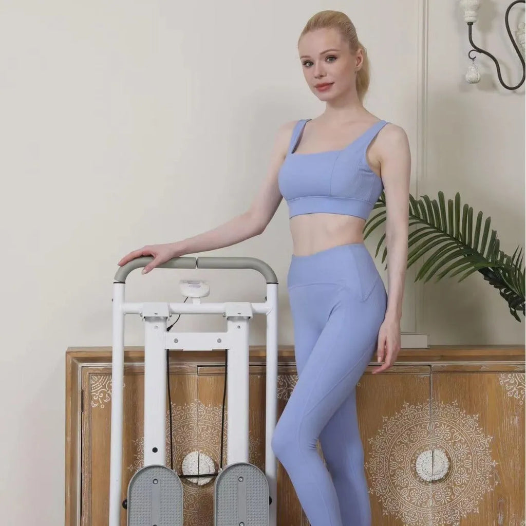 Starlight White foldable treadmill and indoor climbing frame fitness machine for home use.