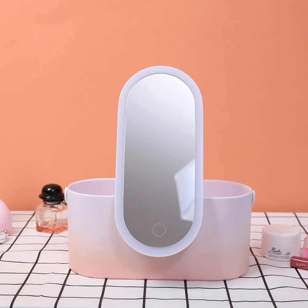 Pink gradient portable makeup storage box with built-in LED mirror, showing USB port and compact dimensions.