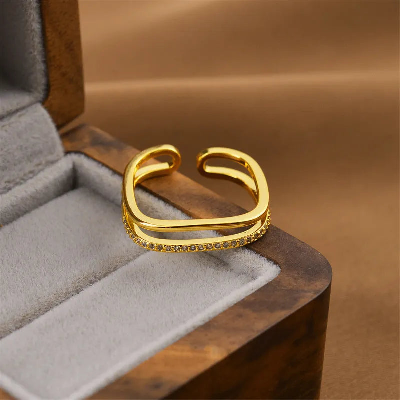 Gold geometric open design women's ring made from electroplated copper, showing one of five available style variations.