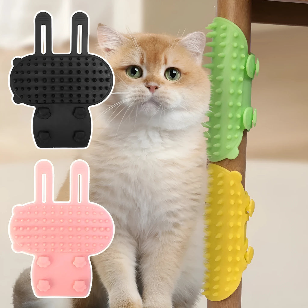 Black silicone cat grooming comb with rounded teeth and adjustable mounting strap for table legs.