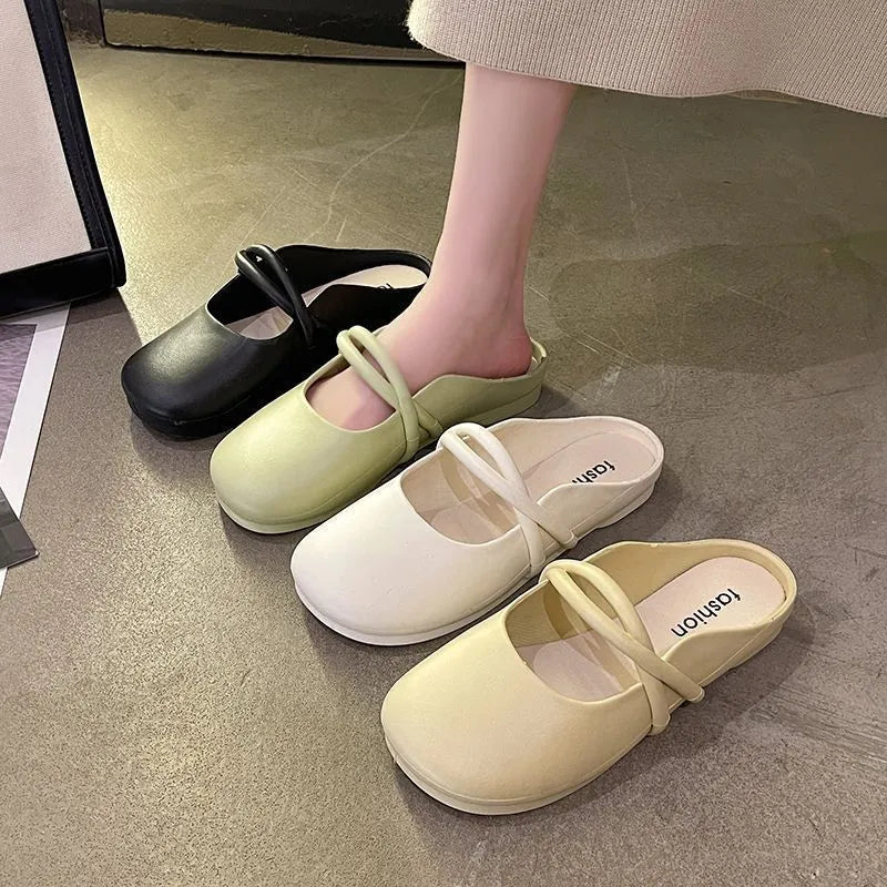 Women's plastic baotou flip flop sandals in green, shown from the side.
