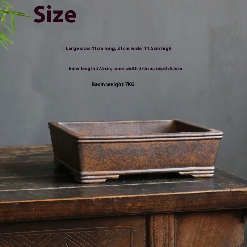 A rectangular purple sand bonsai pot shown in two sizes, for pine, cypress or boxwood trees.