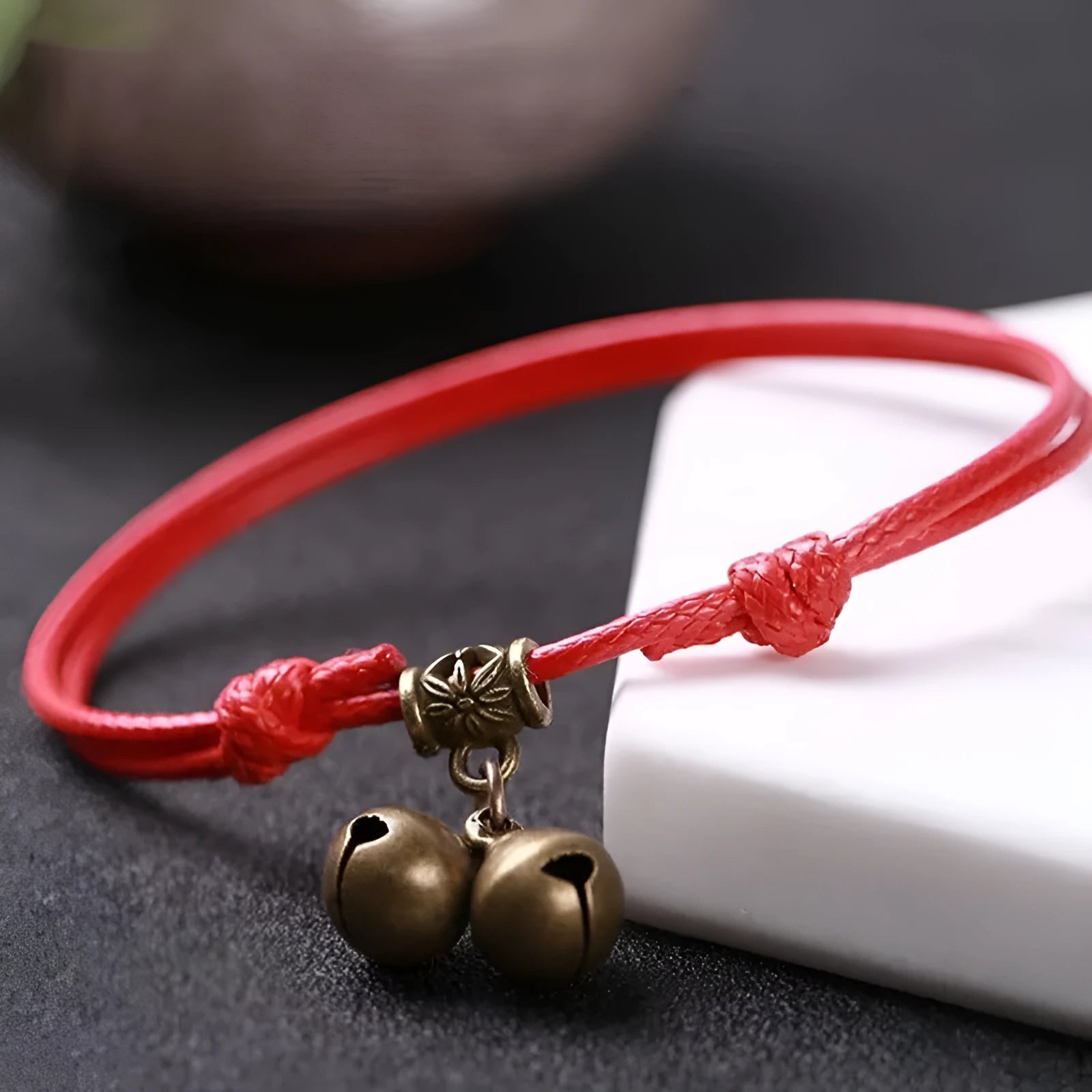 Adjustable nylon dog collar with brass buckle and bell in black, red, or coffee colours