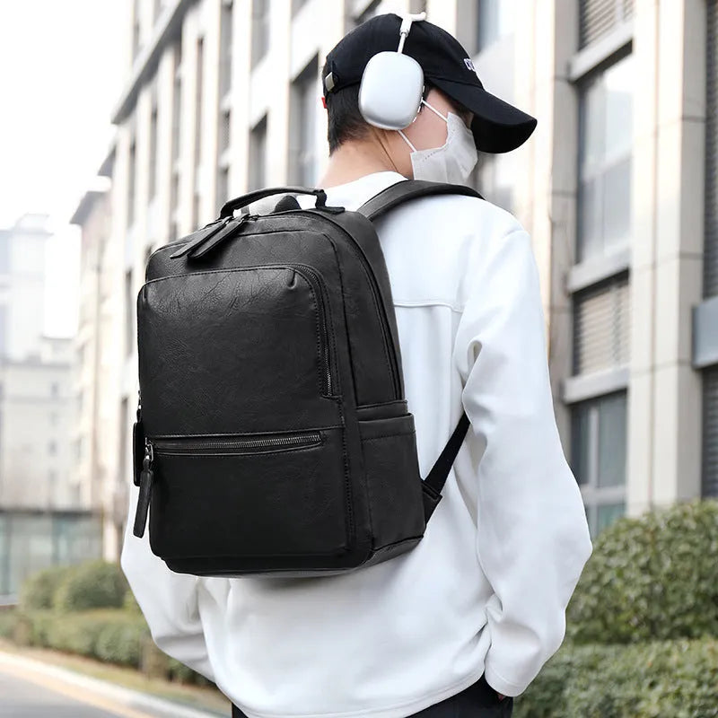 Men's vintage waterproof PU leather backpack in solid colour with retro style, capacity 20-35 litres