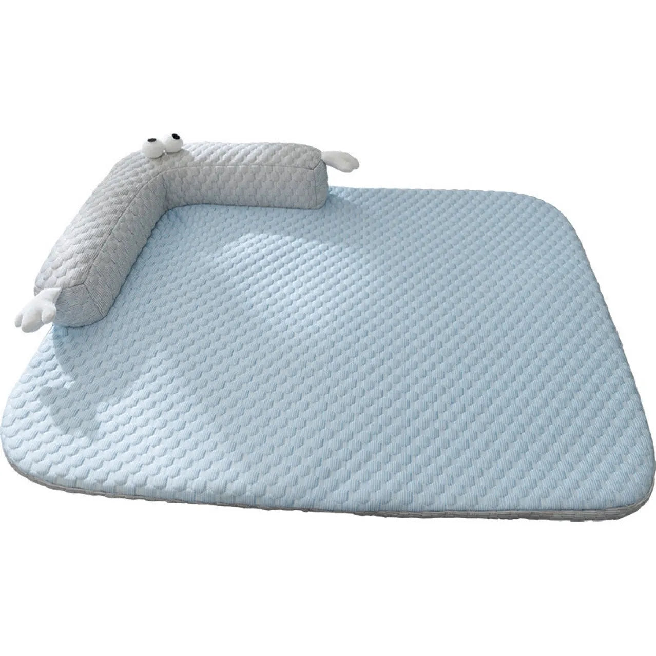 Blue pet cooling pad with big-eyed monster design, shown on a wooden floor.