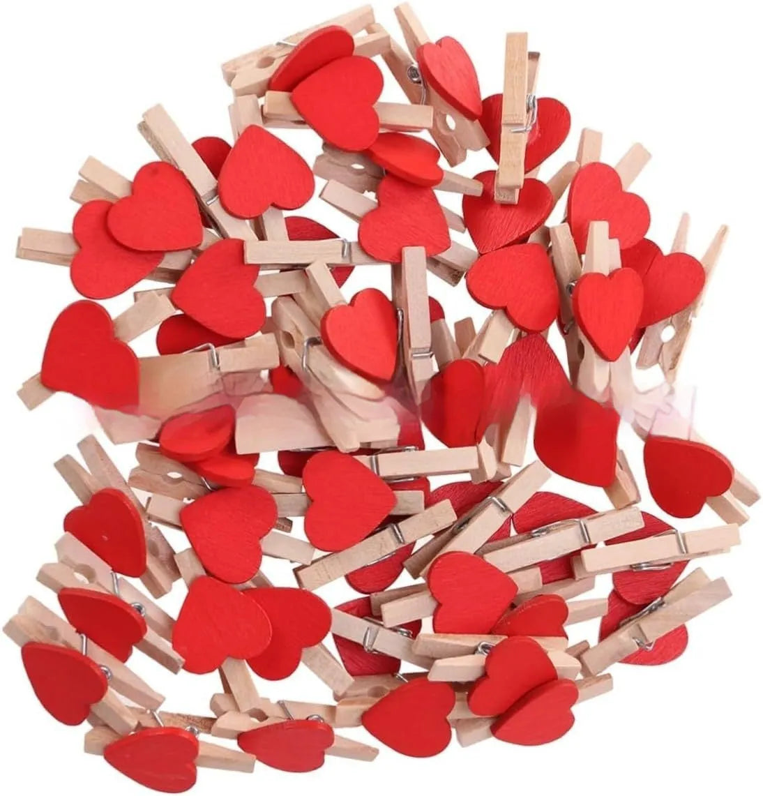 Set of five handmade solid wood heart-shaped clips in assorted colours on a wooden surface.