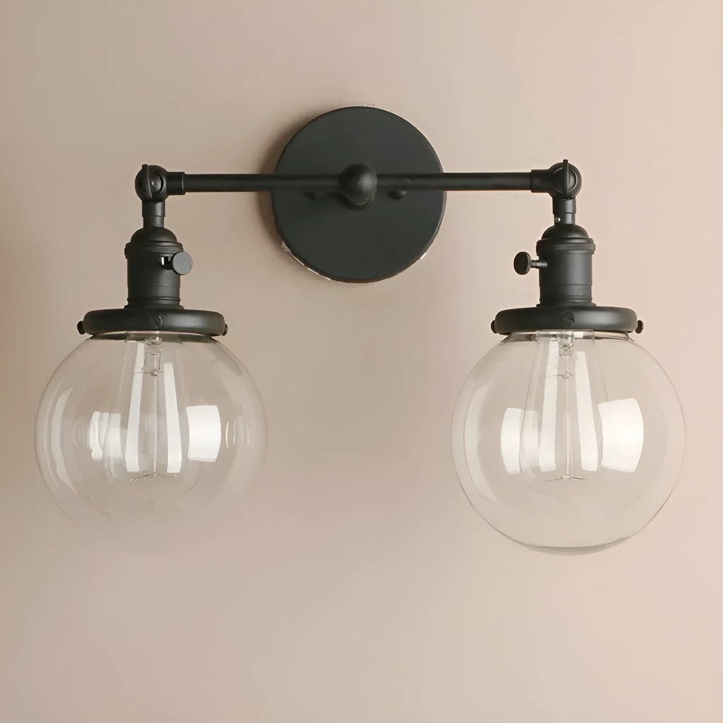 Double headed industrial wall lamp with spherical glass shades, iron black finish, 15x12x24cm