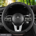 Leather steering wheel cover with crystal texture in black brown colour, round style, on a car steering wheel