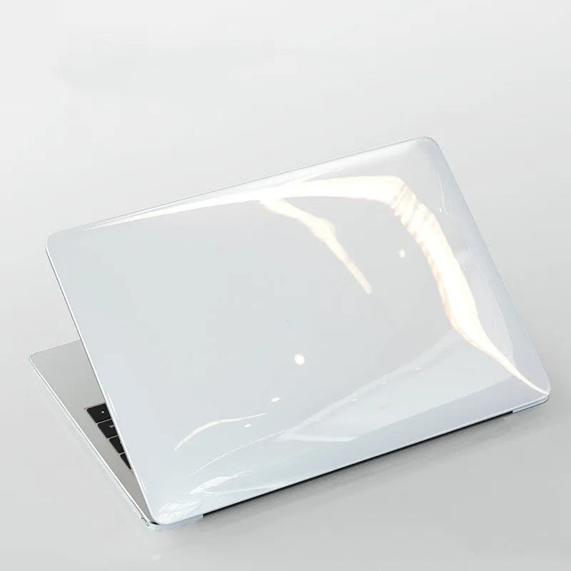 Transparent and black hard PC protective shell case for Apple MacBook Pro 14.2-inch and 16.2-inch laptops.