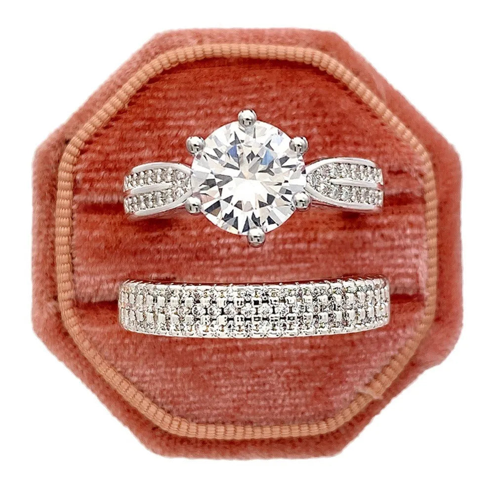 White gold colour alloy combined ring and bracelet with geometric shape and round details.