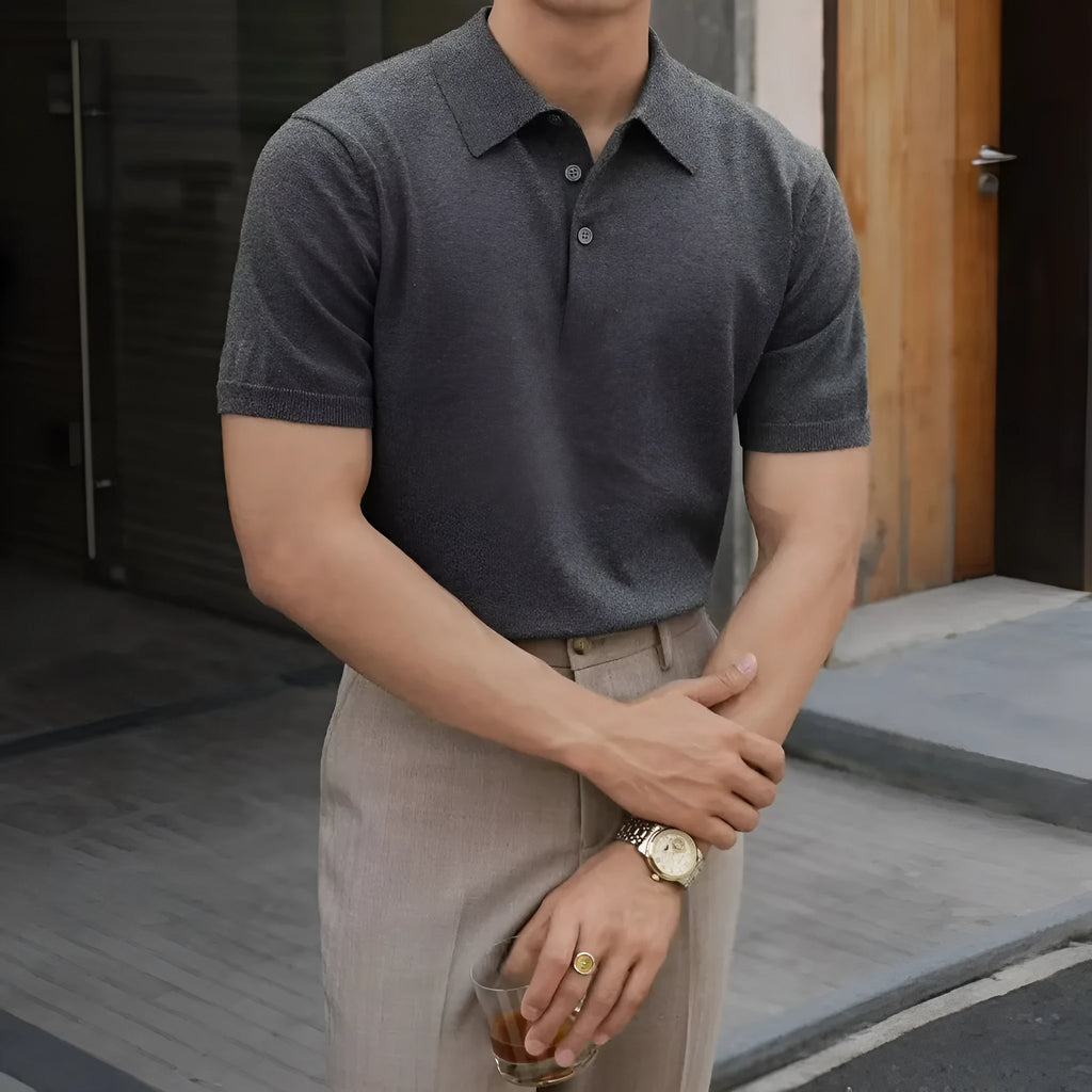 Men's black short sleeve polo shirt with a cotton ice silk knit and classic collar.