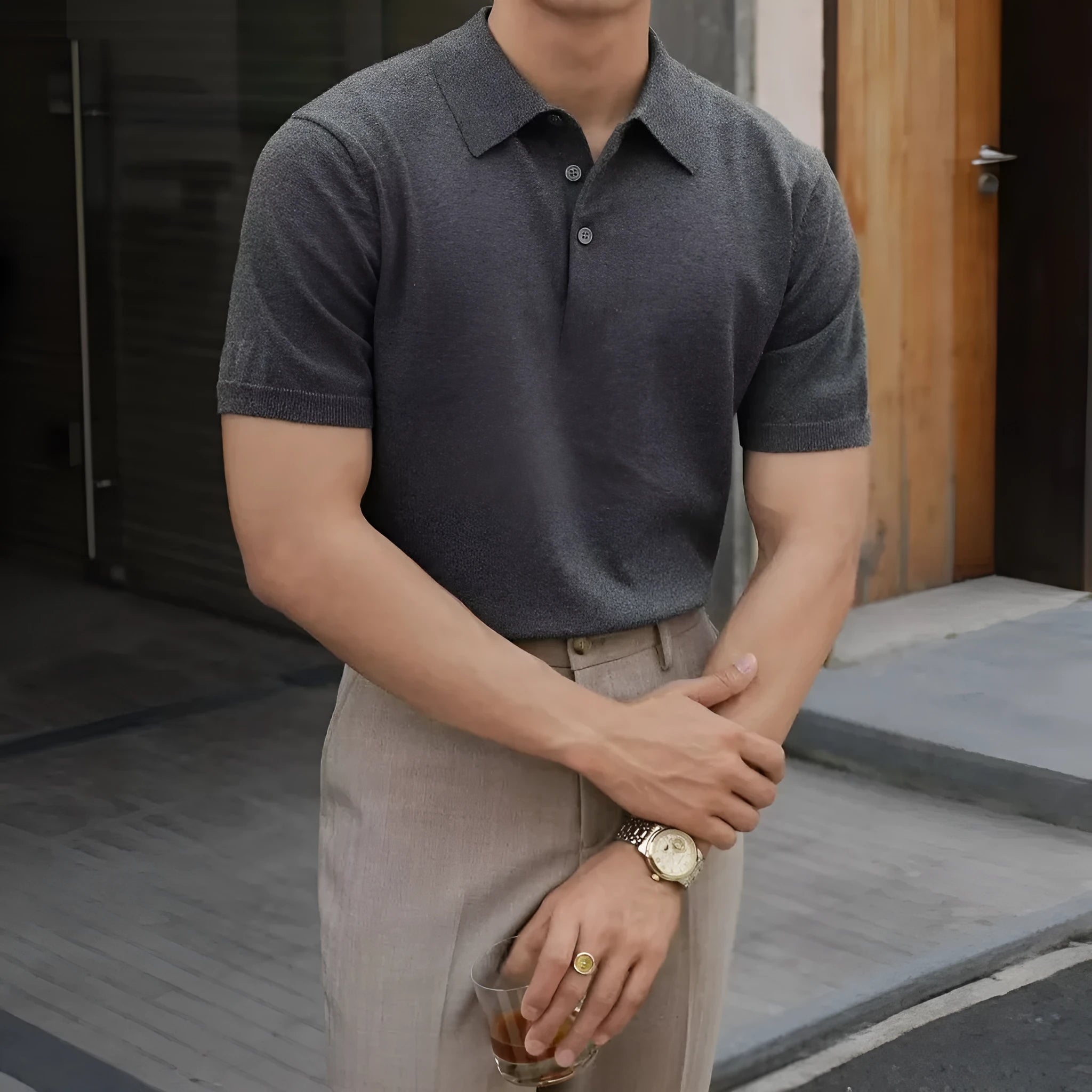 Men's black short sleeve polo shirt with a cotton ice silk knit and classic collar.