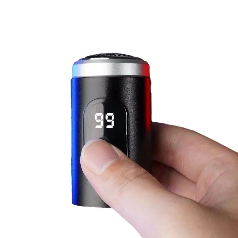 Black portable USB rechargeable shaver with LED display, shown with cleaning brush and cable.
