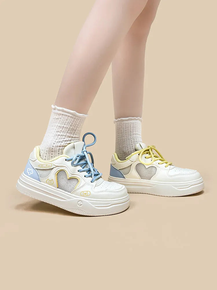 Korean-style white and blue sneakers with mesh cross-straps and lace-up closure for children.