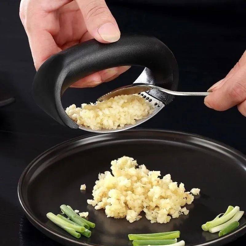 Stainless steel manual garlic press with ergonomic non-slip handle in assorted colours