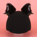 Soft plush cartoon character cover on a motorcycle helmet, showing size M and decorative ear sections.