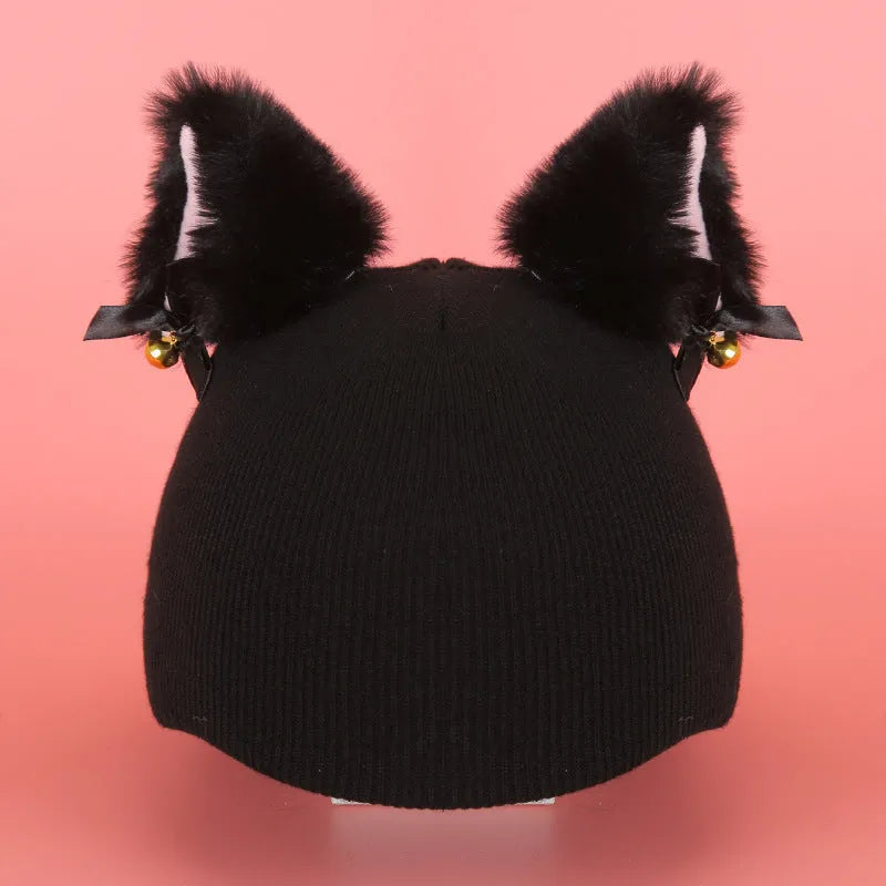 Soft plush cartoon character cover on a motorcycle helmet, showing size M and decorative ear sections.