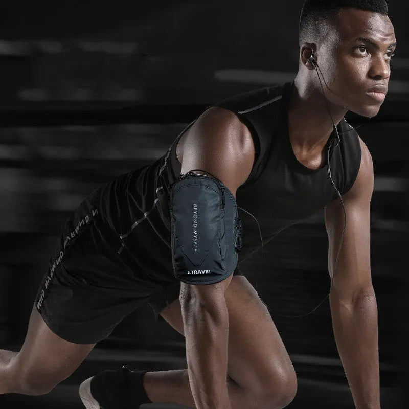 Black reflective running arm bag with adjustable strap, shown on an arm.
