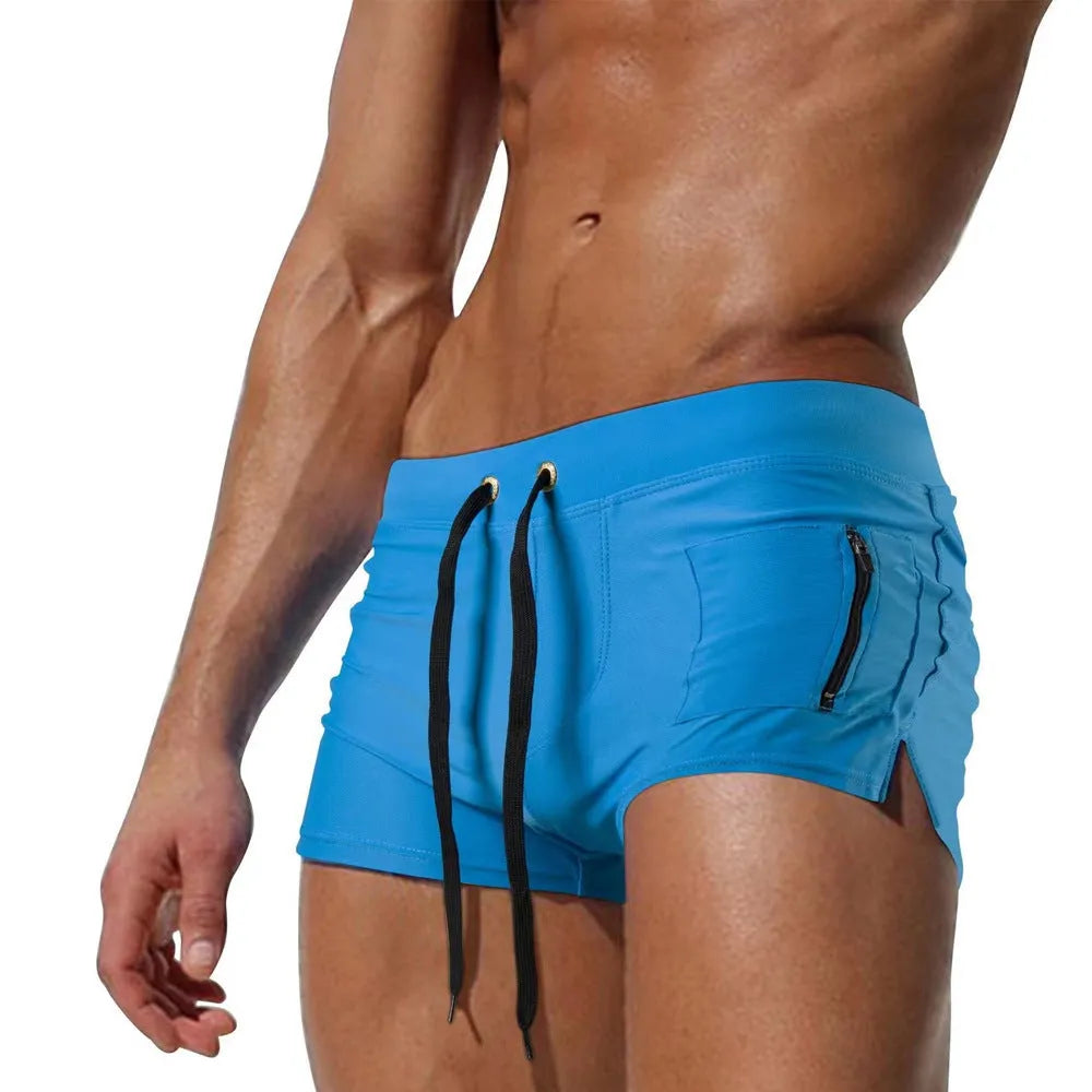 Men's black high waist swimming trunks with a white lace-up front closure.