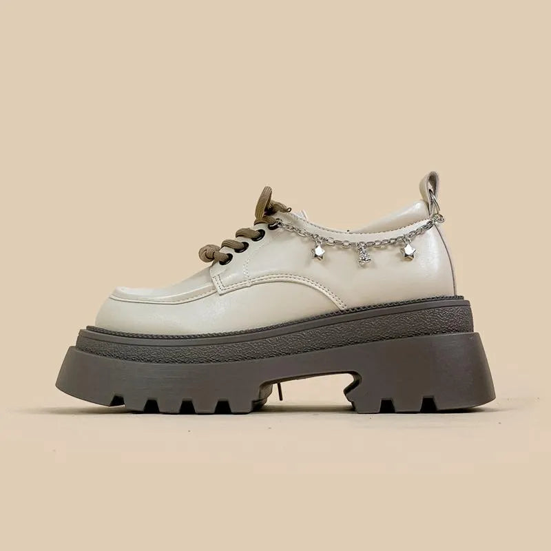 White platform Mary Jane shoes with chunky heel and lace-up front