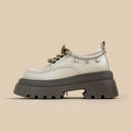 White platform Mary Jane shoes with chunky heel and lace-up front