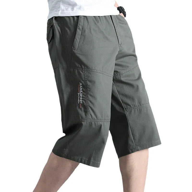 Men's light grey cotton sports pants with straight cut and cropped length on hanger