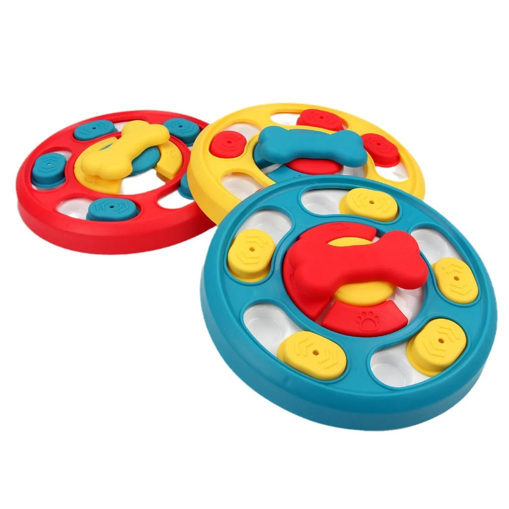 Blue plastic leak-proof feeding puzzle dog toy spinner on floor with kibble