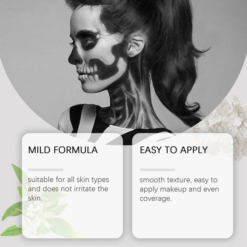 Halloween palette suit with red black white cream foundation palettes, three brushes, and a sponge on a dark background