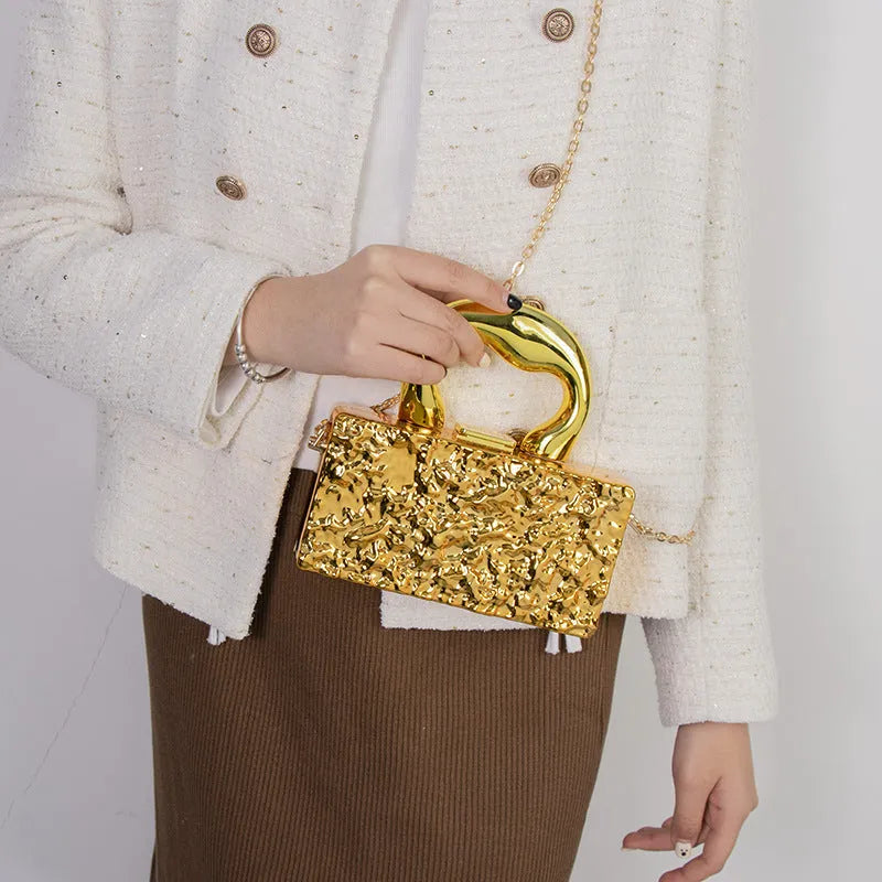 Mini acrylic crossbody bag with chain strap in Silver Corrugated colour