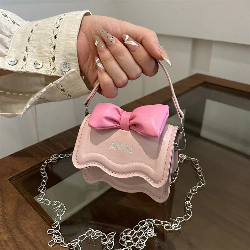 Mini crossbody bag in PU leather with adjustable strap, shown in multiple colour options