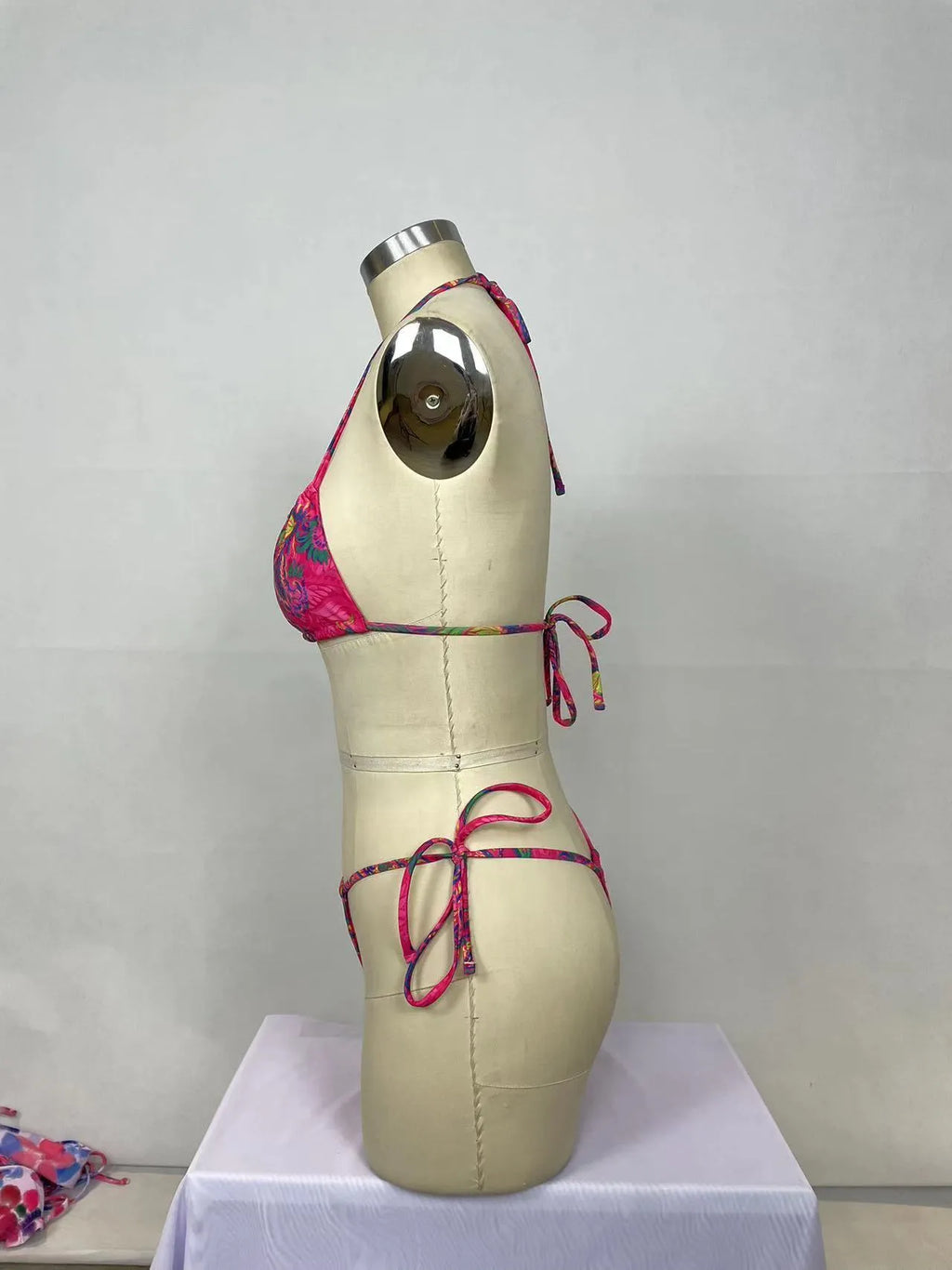 Pink printed women's bikini two-piece set with sleeveless design for swimming and water activities