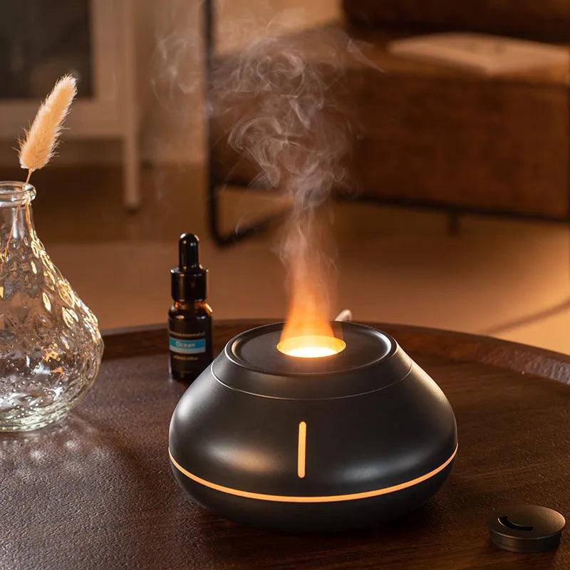 Desktop aroma diffuser humidifier with colourful flame effect in black resin finish