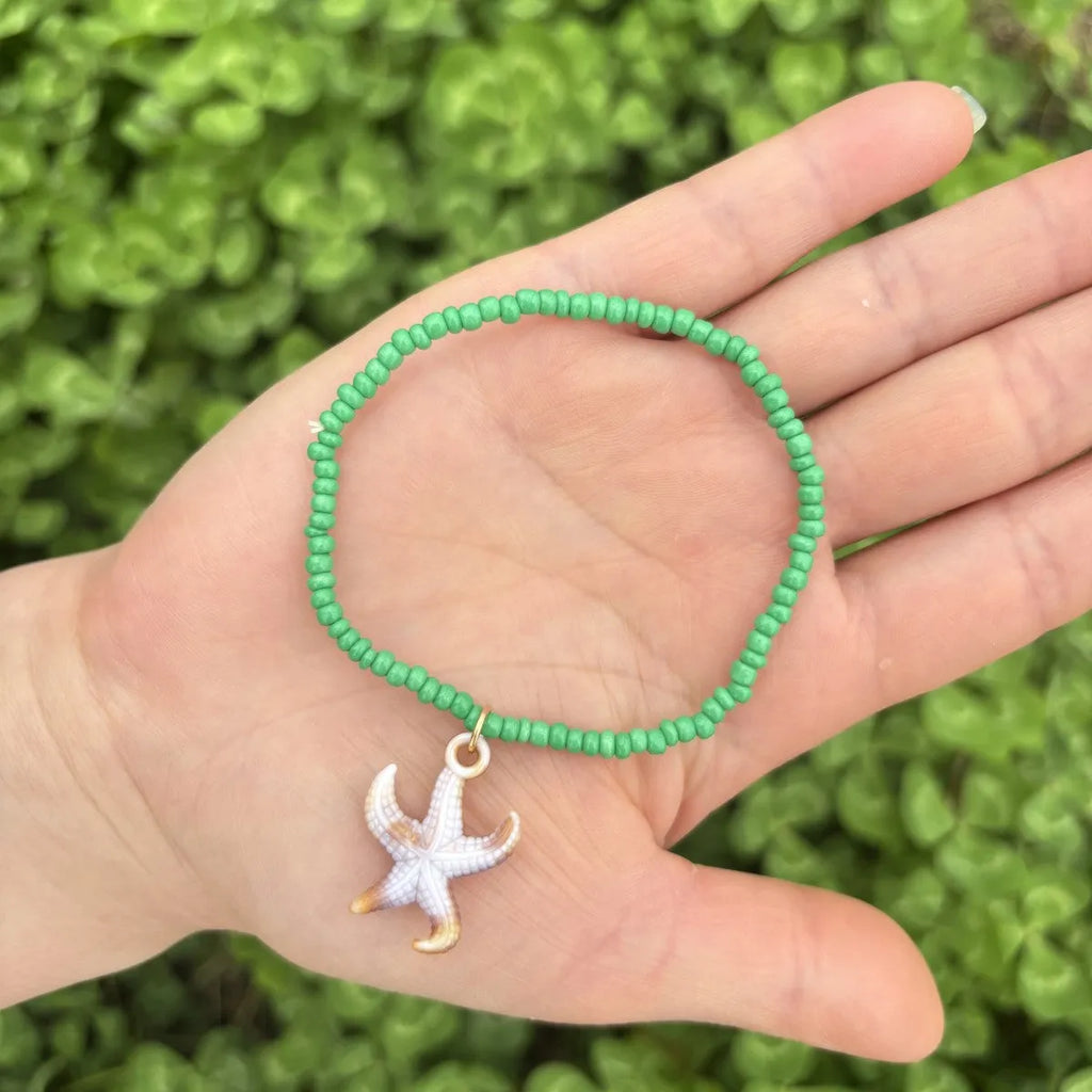 Handmade acrylic rice bead elastic bracelet in doll shape with flower detail, available in multiple colours