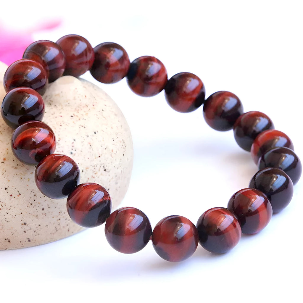 Wood alexandrite tigereye stone hand bracelet with geometric round beads in lightning cat's eye colour.