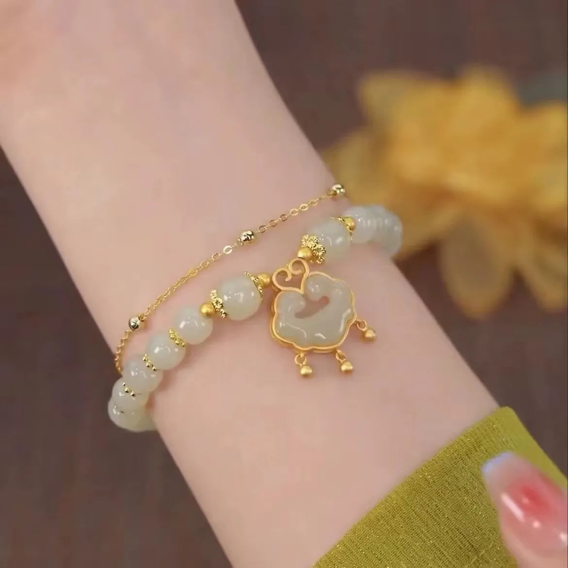 Green double-layer women's bracelet with safety lock bell pendant and drop-shaped charm