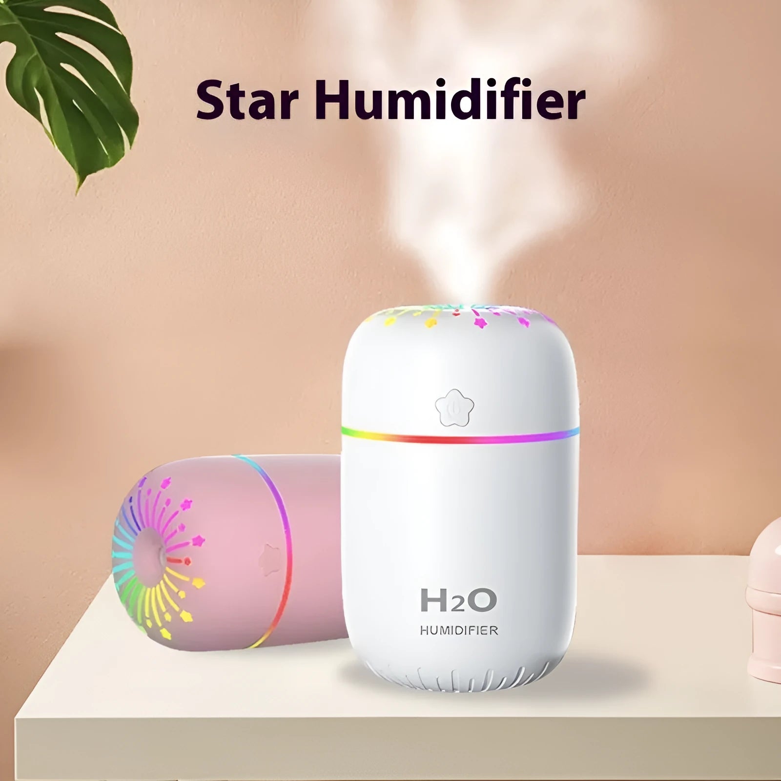 White USB mini humidifier with 300ml water tank on desk beside laptop